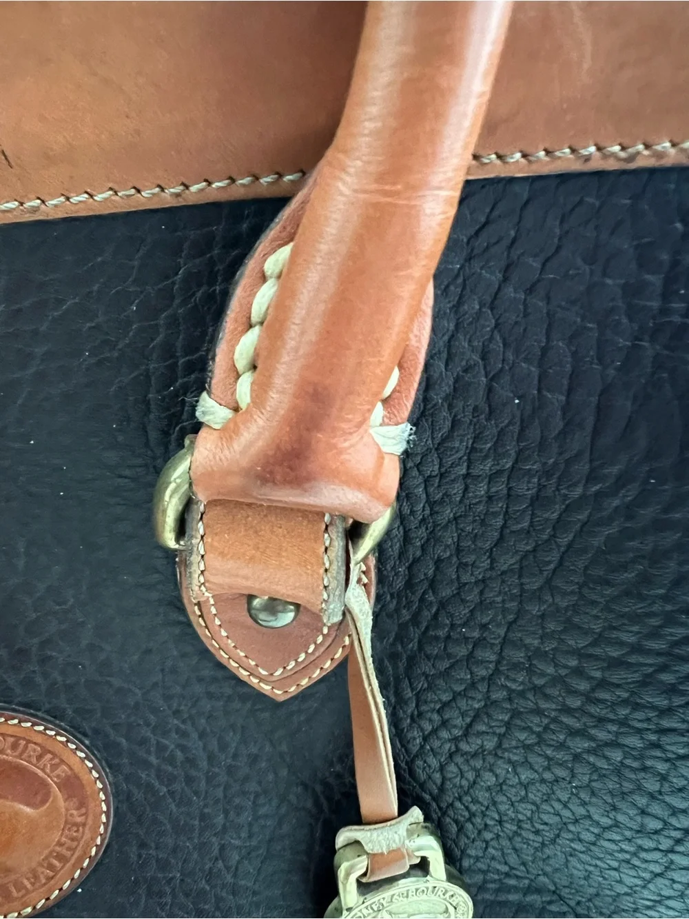 Dooney & Bourke VINTAGE black pebbled Leather satchel with British tan trim.